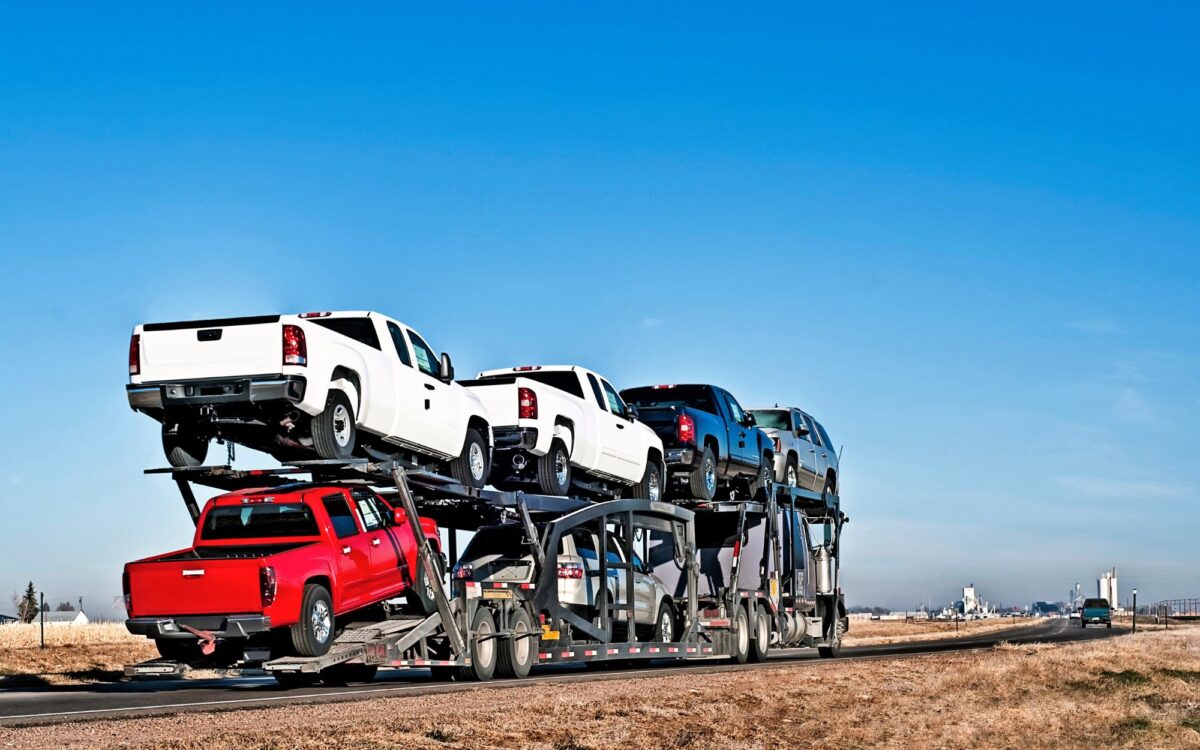 Dark-Three-trucks-on-blue-background-1200x750.jpg